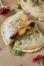 Beet, Pesto, Gouda, and Chicken Calzones